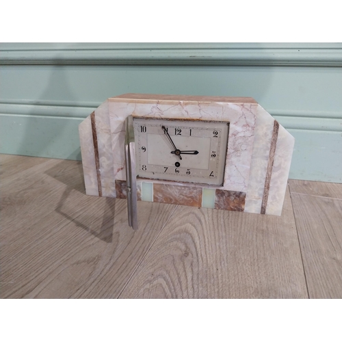 304 - Art Deco marble and onyx mantle clock with silvered dial. {18 cm H x 34 cm W x 10 cm D}.