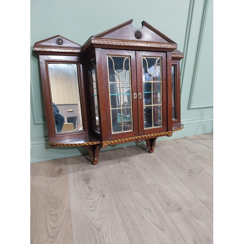 305 - Edwardian and  satinwood mirrored back wall cabinet. {78 cm H x  91 cm W  x 23 cm D}.