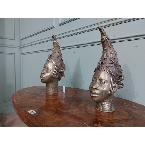 310 - Two African Benin sculptures. {40 cm H x 13 cm W  x23 cm D} and {36 cm H x 16 cm W x 12 cm D].