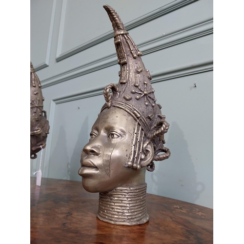 310 - Two African Benin sculptures. {40 cm H x 13 cm W  x23 cm D} and {36 cm H x 16 cm W x 12 cm D].