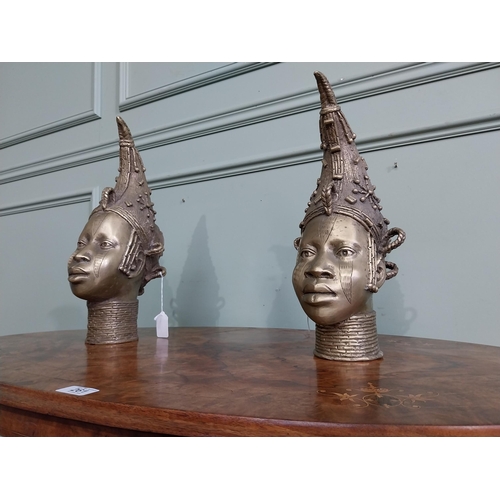 310 - Two African Benin sculptures. {40 cm H x 13 cm W  x23 cm D} and {36 cm H x 16 cm W x 12 cm D].