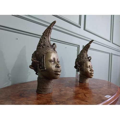 310 - Two African Benin sculptures. {40 cm H x 13 cm W  x23 cm D} and {36 cm H x 16 cm W x 12 cm D].