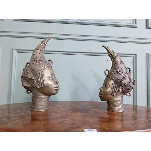 310 - Two African Benin sculptures. {40 cm H x 13 cm W  x23 cm D} and {36 cm H x 16 cm W x 12 cm D].