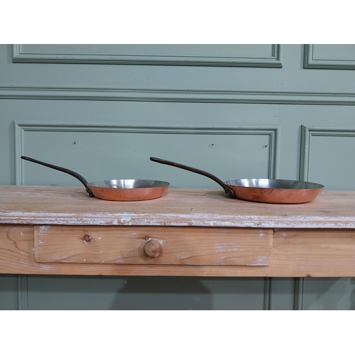 311 - Two early 20th C French copper and wrought iron frying pans. {5 cm H x 51 cm W x 28 cm D} and  {4 cm... 