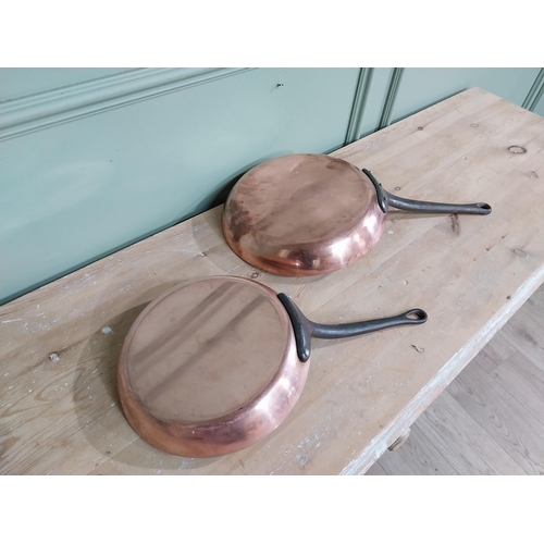 311 - Two early 20th C French copper and wrought iron frying pans. {5 cm H x 51 cm W x 28 cm D} and  {4 cm... 