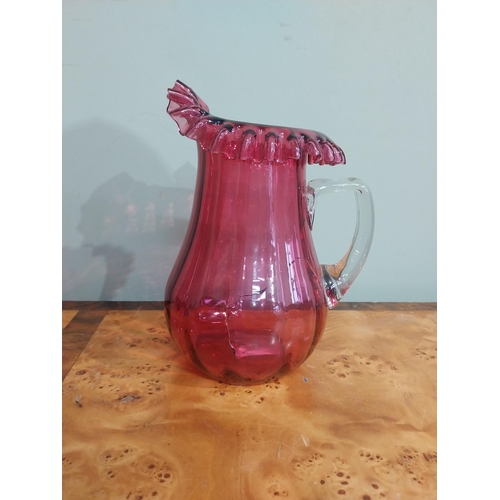 317 - Early 20th C. Ruby glass jug {cracked), thumb lamp and vase. {24 cm H x 22 cm H}