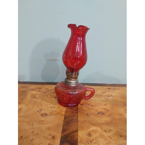 317 - Early 20th C. Ruby glass jug {cracked), thumb lamp and vase. {24 cm H x 22 cm H}