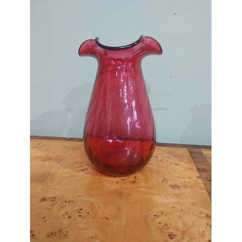 317 - Early 20th C. Ruby glass jug {cracked), thumb lamp and vase. {24 cm H x 22 cm H}