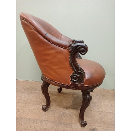 318 - Victorian walnut and upholstered tan leather swivel library chair tan leather cabriole legs and claw... 