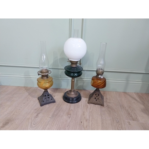 319 - Three late 19th C. Oil lamps with coloured glass bowls and one opaline glass shade. {61 cm H and 56 ... 