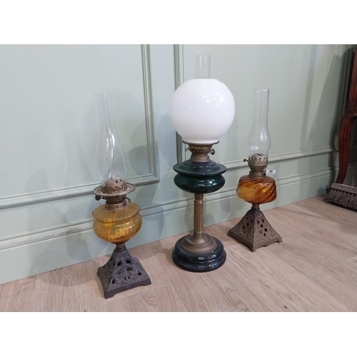 319 - Three late 19th C. Oil lamps with coloured glass bowls and one opaline glass shade. {61 cm H and 56 ... 