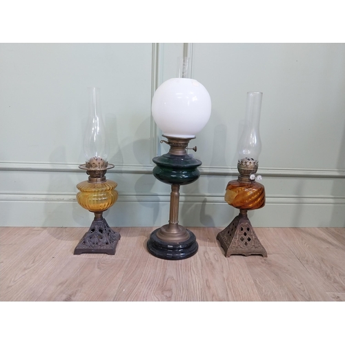 319 - Three late 19th C. Oil lamps with coloured glass bowls and one opaline glass shade. {61 cm H and 56 ... 