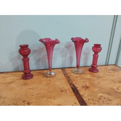 32 - Pair of Victorian ruby glass fluted vases {27 cm H} and two ruby glass candlesticks {22 cm H}.