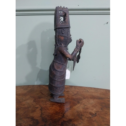 323 - African Benin bronze sculpture. {36 cm H x 12 cm W x 40 cm D}.