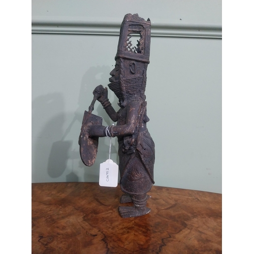 323 - African Benin bronze sculpture. {36 cm H x 12 cm W x 40 cm D}.