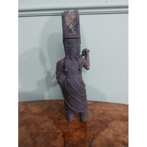 323 - African Benin bronze sculpture. {36 cm H x 12 cm W x 40 cm D}.