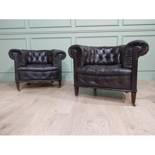 331 - Pair of 19th C hand dyed leather deep buttoned Chesterfield club chairs on tapered feet and castors.... 