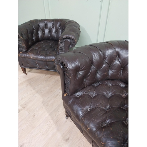 331 - Pair of 19th C hand dyed leather deep buttoned Chesterfield club chairs on tapered feet and castors.... 