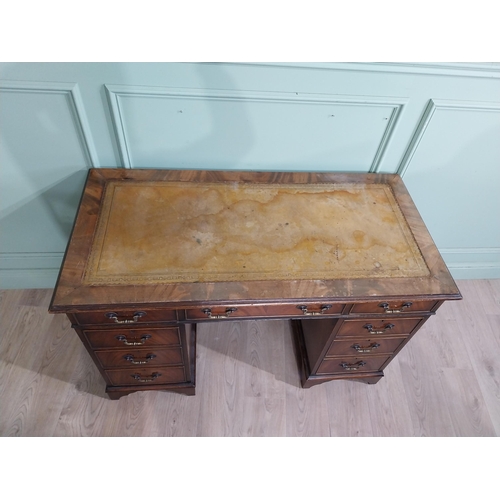 335 - Mahogany pedestal desk with inset leather top in the Victorian style. {77 cm H x 122 cm W x 61 cm}.