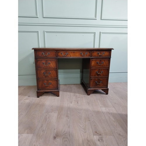 335 - Mahogany pedestal desk with inset leather top in the Victorian style. {77 cm H x 122 cm W x 61 cm}.