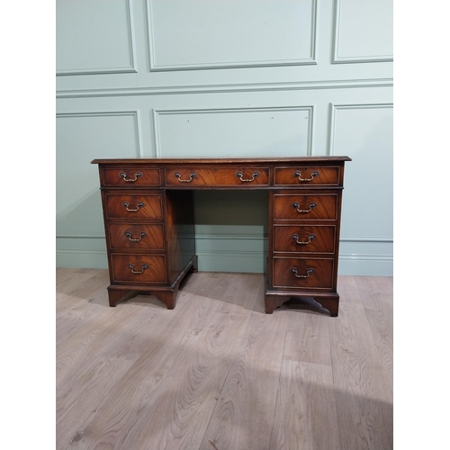 335 - Mahogany pedestal desk with inset leather top in the Victorian style. {77 cm H x 122 cm W x 61 cm}.