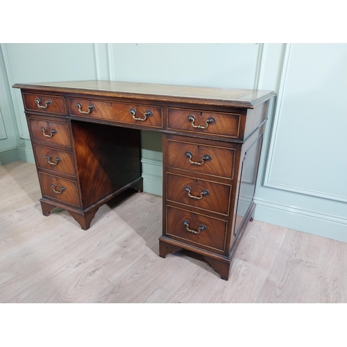 335 - Mahogany pedestal desk with inset leather top in the Victorian style. {77 cm H x 122 cm W x 61 cm}.