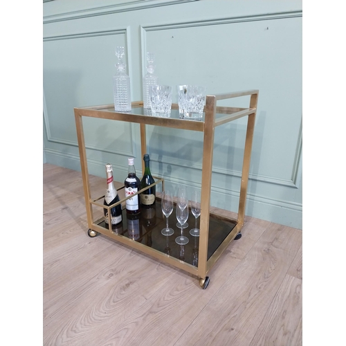 342 - Mid century Italian brass and smoked brass drink�s trolley. {74 cm H x 67 cm W x 45 cm D}.