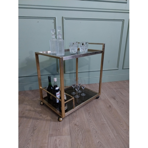 342 - Mid century Italian brass and smoked brass drink�s trolley. {74 cm H x 67 cm W x 45 cm D}.