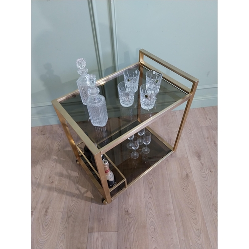 342 - Mid century Italian brass and smoked brass drink�s trolley. {74 cm H x 67 cm W x 45 cm D}.