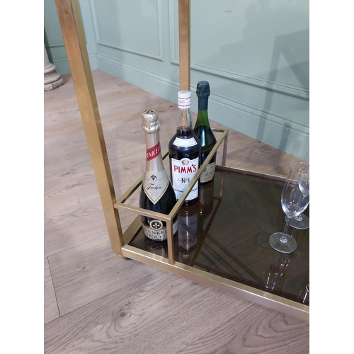 342 - Mid century Italian brass and smoked brass drink�s trolley. {74 cm H x 67 cm W x 45 cm D}.