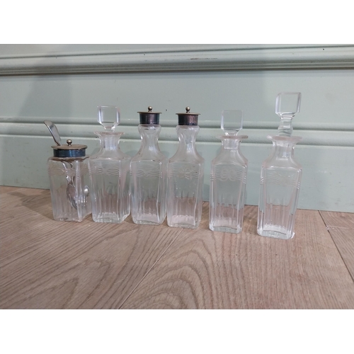 343 - Collection of Victorian cut glass bottles and two spoons {17 cm H to 5 cm H}.