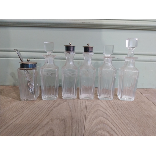 343 - Collection of Victorian cut glass bottles and two spoons {17 cm H to 5 cm H}.