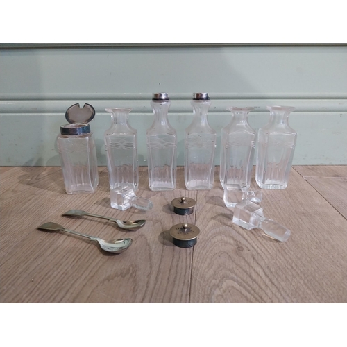 343 - Collection of Victorian cut glass bottles and two spoons {17 cm H to 5 cm H}.