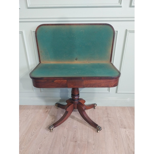 367 - Regency rosewood turn over leaf card table on single turned column with four outswept paw feet and c... 