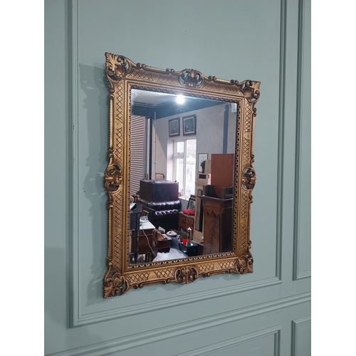 375 - Carved giltwood mirror in the  Victorian style. {88 cm H x 68 cm W}.