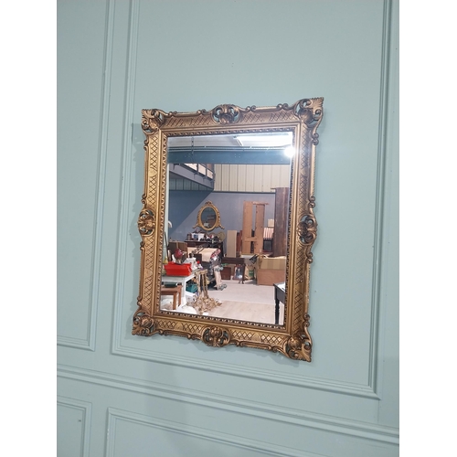 375 - Carved giltwood mirror in the  Victorian style. {88 cm H x 68 cm W}.