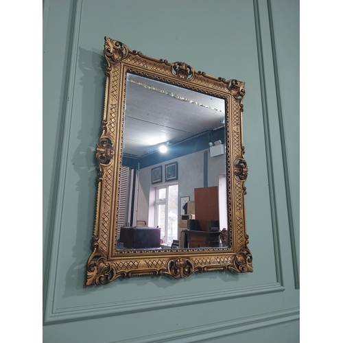 375 - Carved giltwood mirror in the  Victorian style. {88 cm H x 68 cm W}.