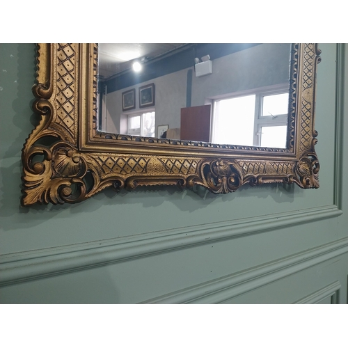 375 - Carved giltwood mirror in the  Victorian style. {88 cm H x 68 cm W}.