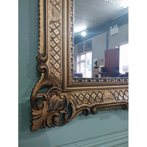 375 - Carved giltwood mirror in the  Victorian style. {88 cm H x 68 cm W}.