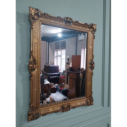 375 - Carved giltwood mirror in the  Victorian style. {88 cm H x 68 cm W}.