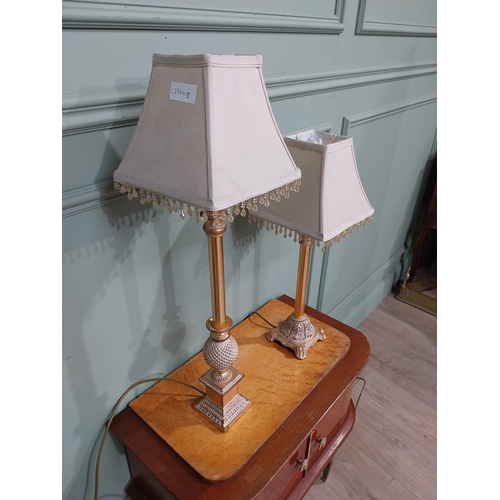 379 - Pair of decorative gilded resin table lamps with cloth shades. {69 cm H and 40 cm H}.