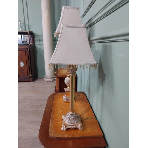 379 - Pair of decorative gilded resin table lamps with cloth shades. {69 cm H and 40 cm H}.