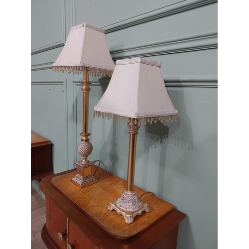 379 - Pair of decorative gilded resin table lamps with cloth shades. {69 cm H and 40 cm H}.