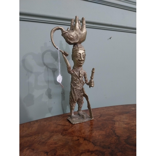 382 - African Benin bronze sculpture. {35 cm H x 13 cm W x 10 cm D}.