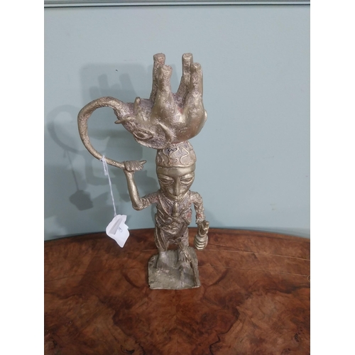 382 - African Benin bronze sculpture. {35 cm H x 13 cm W x 10 cm D}.