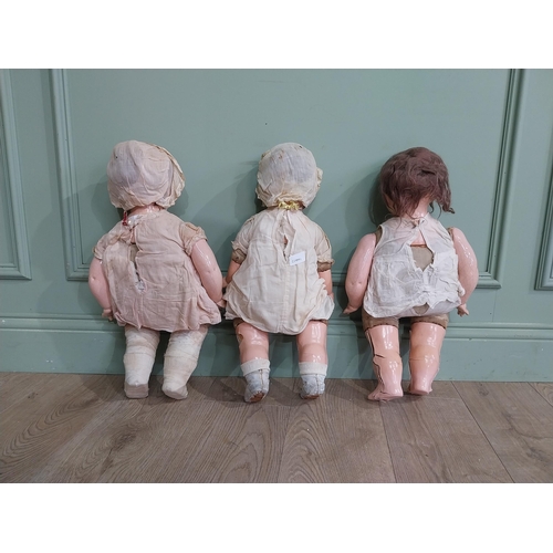 392 - Three early 20th C Horsman ceramic Dolls. {56 cm H x 27 cm W x 16 cm D]