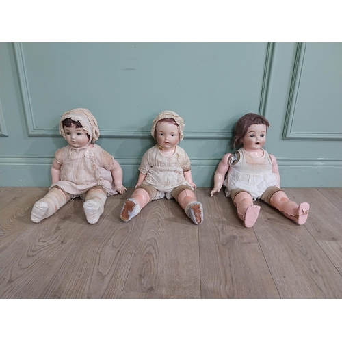 392 - Three early 20th C Horsman ceramic Dolls. {56 cm H x 27 cm W x 16 cm D]