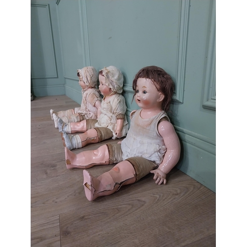 392 - Three early 20th C Horsman ceramic Dolls. {56 cm H x 27 cm W x 16 cm D]