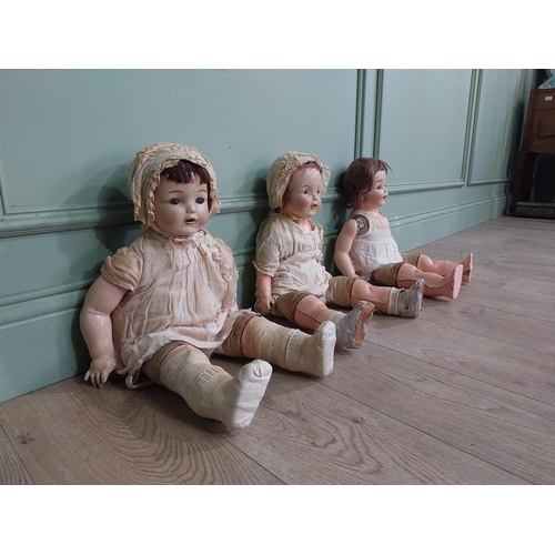 392 - Three early 20th C Horsman ceramic Dolls. {56 cm H x 27 cm W x 16 cm D]