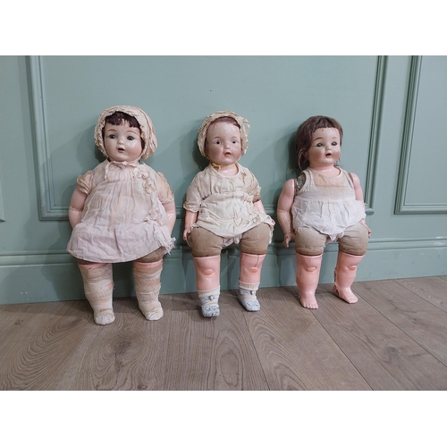 392 - Three early 20th C Horsman ceramic Dolls. {56 cm H x 27 cm W x 16 cm D]